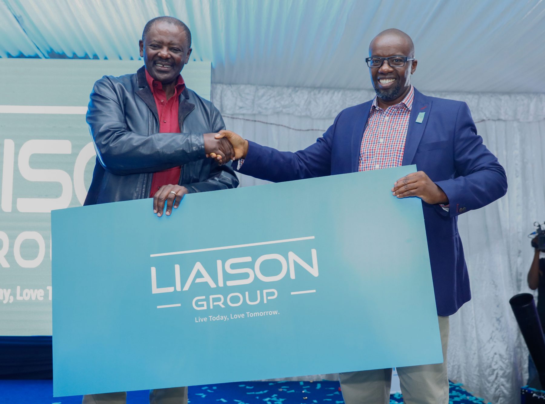 Group Managing Director Liaison Group Mr. Tom Mulwa (right) and Chairman of Liaison Group Mr. Wachira Mahihu, unveil the new brand identity for Liaison Group