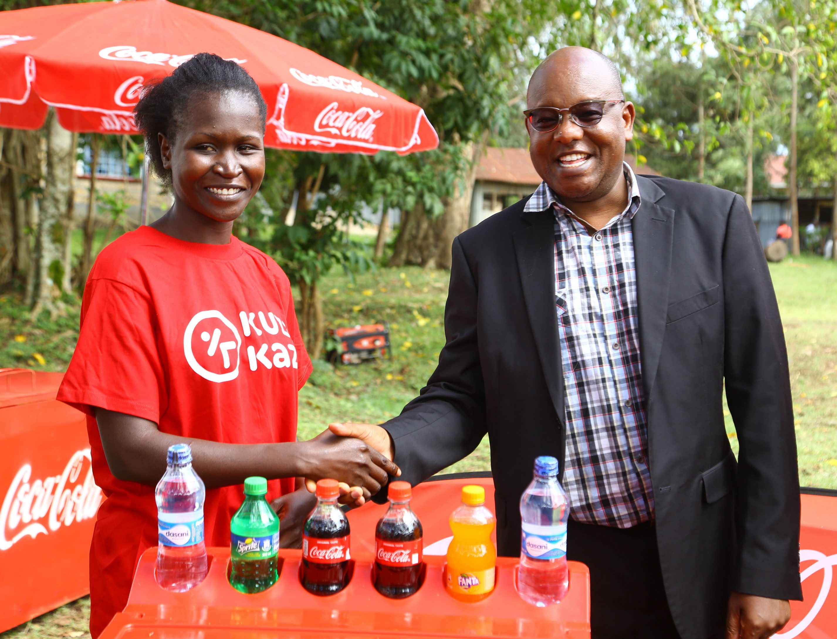 Almasi Beverages Limited General Manager, Japheth Ng’etich with Winne ...