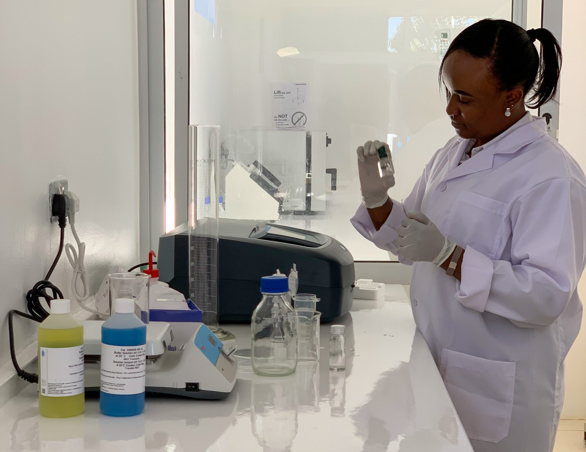 Jane Ndirangu, one of the laboratory analysts, working on water quality